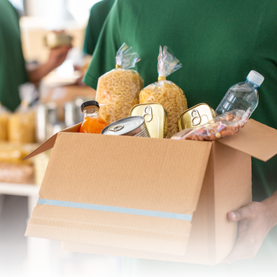 A person holding a box of groceries. 